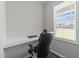 Bright office nook features a built-in desk with a picture window and a comfortable office chair at 676 Wall Rd, Wendell, NC 27591