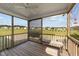 Covered porch with outdoor seating, wood flooring, and a view of the neighborhood at 676 Wall Rd, Wendell, NC 27591