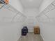 Functional walk-in closet with metal shelving, carpet, and ample space for storage at 676 Wall Rd, Wendell, NC 27591