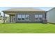Backyard features a well-maintained lawn and neutral-toned exterior siding at 700 Deschutes Dr, Garner, NC 27529