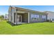 The backyard features well-maintained lawn, and sliding glass door access at 700 Deschutes Dr, Garner, NC 27529