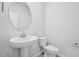 Bathroom with modern sink, toilet and fixtures at 700 Deschutes Dr, Garner, NC 27529