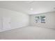 A spacious bedroom featuring plush gray carpeting and natural light from large windows at 700 Deschutes Dr, Garner, NC 27529