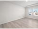 Bright bedroom with tray ceiling, recessed lighting, and view from a window at 700 Deschutes Dr, Garner, NC 27529