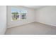 Bright bedroom with plush carpeting, neutral walls, and a sunny window with neighborhood views at 700 Deschutes Dr, Garner, NC 27529