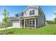A lovely two-story home displays a two car garage, well-kept lawn, and attractive curb appeal at 700 Deschutes Dr, Garner, NC 27529