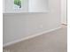 Bright upstairs hallway features white walls and trim, and plush carpeting at 700 Deschutes Dr, Garner, NC 27529