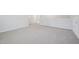 A bright hallway with plush gray carpeting and white trim, creating a clean and inviting space at 700 Deschutes Dr, Garner, NC 27529