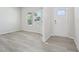 Bright living room featuring new floors, natural light through the windows, and a clean, neutral color scheme at 700 Deschutes Dr, Garner, NC 27529