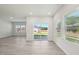 Open living room with large windows and sliding doors that invite natural light and showcase outdoor views at 700 Deschutes Dr, Garner, NC 27529