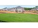 New construction home surrounded by a lush green lawn at 700 Deschutes Dr, Garner, NC 27529