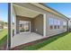 Covered back patio with concrete floor and vinyl siding at 700 Deschutes Dr, Garner, NC 27529