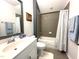 Well-lit bathroom featuring a combination shower and bathtub at 7125 Crested Iris Pl, Durham, NC 27703