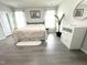 Serene bedroom with a comfortable bed, hardwood floors, and ample natural light at 7125 Crested Iris Pl, Durham, NC 27703