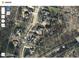 Aerial view of the property outlined in red, highlighting the spacious lot and proximity to surrounding homes at 7312 Ridgeline Dr, Raleigh, NC 27613