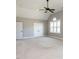 Bright bedroom features plush carpet, double closets, and large window for natural light at 7312 Ridgeline Dr, Raleigh, NC 27613