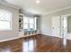 Cozy bonus room with custom built-ins, window seat, and hardwood floors at 7312 Ridgeline Dr, Raleigh, NC 27613