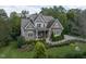 Beautiful home with manicured lawn, stone accents, lush landscaping, and a welcoming front porch at 7312 Ridgeline Dr, Raleigh, NC 27613