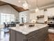 A kitchen showcases granite countertops, white cabinets, stainless steel appliances, and hardwood floors at 7312 Ridgeline Dr, Raleigh, NC 27613