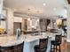A kitchen features granite countertops, white cabinets, stainless steel appliances, hardwood floors, and an open concept at 7312 Ridgeline Dr, Raleigh, NC 27613