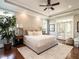 Spacious main bedroom with a tray ceiling, large windows, and access to a private balcony at 7312 Ridgeline Dr, Raleigh, NC 27613