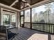 Inviting screened porch with wood ceiling, ceiling fan and private wooded view, perfect for outdoor relaxation at 7312 Ridgeline Dr, Raleigh, NC 27613