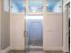 Modern tiled shower with a glass door, custom lighting, and a built-in niche at 7312 Ridgeline Dr, Raleigh, NC 27613