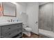 Well-lit bathroom features a single vanity, a toilet, and a modern shower with tile surround at 8211 Julian Rd, Dunn, NC 28334