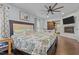 Spacious primary bedroom with fireplace and TV offers a luxurious retreat at 8211 Julian Rd, Dunn, NC 28334
