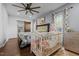 Cozy bedroom with wood floors, ceiling fan, and stylish decor at 8211 Julian Rd, Dunn, NC 28334