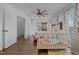 Cozy bedroom features a modern ceiling fan, wood accents, and an inviting crib for a  at 8211 Julian Rd, Dunn, NC 28334