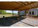 Carport area that provides covered parking space adjacent to the house and backyard at 8211 Julian Rd, Dunn, NC 28334