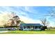 Exterior view of the house featuring a charming front porch and ample parking space at 8211 Julian Rd, Dunn, NC 28334