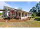 Charming one-story home with a welcoming porch and beautifully landscaped front yard at 8211 Julian Rd, Dunn, NC 28334