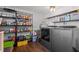 Functional laundry room with modern washer and dryer, shelving, and storage solutions at 8211 Julian Rd, Dunn, NC 28334