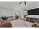 Inviting living room with cozy seating, a decorative rug, and a stylish entertainment center at 8211 Julian Rd, Dunn, NC 28334