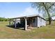 Outdoor shed used for tools with a shaded carport area attached at 8211 Julian Rd, Dunn, NC 28334