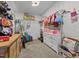 Functional walk-in closet with a wooden dresser, clothes rack, and essentials storage at 8211 Julian Rd, Dunn, NC 28334