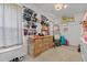 Spacious walk-in closet offers lots of storage space, carpet, and a light fixture in the center at 8211 Julian Rd, Dunn, NC 28334