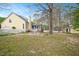 Sprawling backyard with a screened-in porch, privacy fence, and mature trees for shade at 8508 Kayenta Ct, Wake Forest, NC 27587