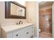 Bathroom featuring a marble vanity and a beautiful tile shower with glass door at 8508 Kayenta Ct, Wake Forest, NC 27587