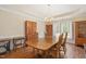 Charming dining room with hardwood floors, wood table, and traditional decor at 8508 Kayenta Ct, Wake Forest, NC 27587