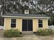 Exterior of a Yellow shed with double doors and windows at 8508 Kayenta Ct, Wake Forest, NC 27587