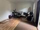 Shed interior featuring hardwood flooring and white walls with stored items at 8508 Kayenta Ct, Wake Forest, NC 27587