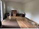 Shed interior featuring hardwood flooring and white walls with lots of potential storage at 8508 Kayenta Ct, Wake Forest, NC 27587