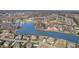 Expansive aerial view of a lakeside community showcasing numerous houses and lush greenery surrounding a scenic lake at 915 Dunleigh Dr, Burlington, NC 27215