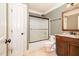 Bathroom featuring walk-in shower, wood vanity, and tile floors at 915 Dunleigh Dr, Burlington, NC 27215