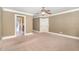 Spacious bedroom with neutral walls, carpet, ceiling fan and ensuite bathroom at 915 Dunleigh Dr, Burlington, NC 27215