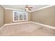 Large bedroom featuring natural light, neutral walls, carpet and ceiling fan at 915 Dunleigh Dr, Burlington, NC 27215