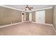 Large bedroom featuring neutral walls, carpet, and white trim with ensuite bathroom at 915 Dunleigh Dr, Burlington, NC 27215